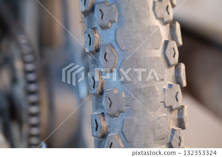 Worn out rear tire of motorbike. Old rubber tire on bike have to be changed to drive Worn out rear tire of motorbike. Old rubber tire on bike have to be changed to drive 132353324