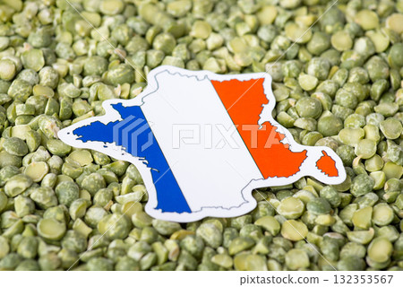 Small flag and map of France in green pea. Concept of origin of pea grain, harvest of pea in France Small flag and map of France in green pea. Concept of origin of pea grain, harvest of pea in France 132353567