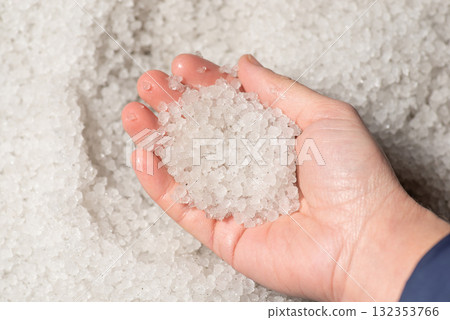 Hail in hand of girl. Hailstorm in summer concept, everything covered in hail Hail in hand of girl. Hailstorm in summer concept, everything covered in hail 132353766
