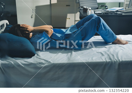 A patient with depression looks outside. A patient with depression looks outside. 132354220
