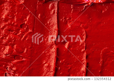 Red lipstick background texture smudged. Close up. 132354312