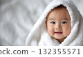 Baby wearing a towel 132355571