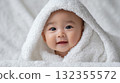 Baby wearing a towel 132355572