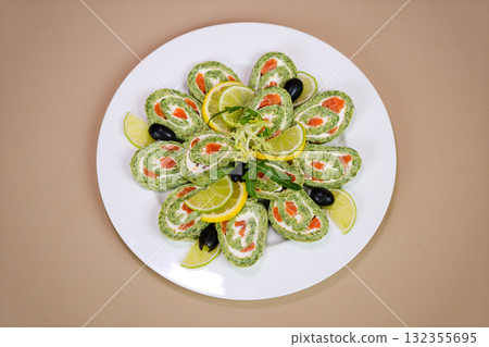 spinach pancakes with red fish with filling on a white plate macro photo 132355695