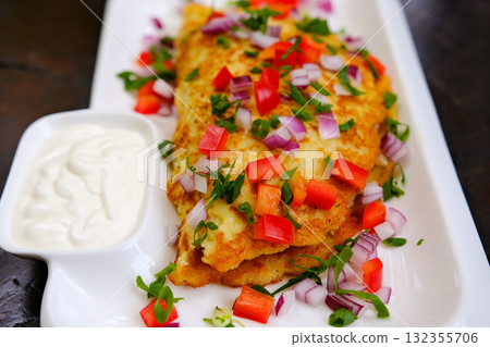 Breakfast. Omelette with tomatoes, avocado, blue cheese and green peas on white plate. Frittata italian omelet. 132355706