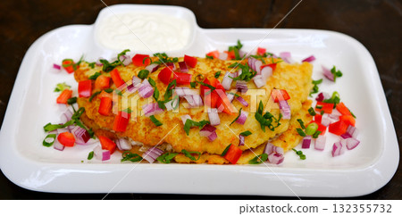 Breakfast. Omelette with tomatoes, avocado, blue cheese and green peas on white plate. Frittata italian omelet. 132355732
