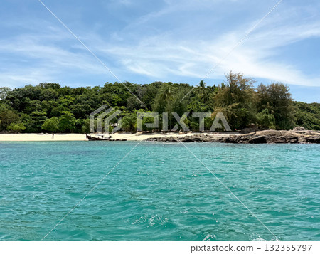 Tropical view of Bon Island, Thailand with turquoise sea, sandy beach and traditional boat. Vacation and tourism concept. 132355797