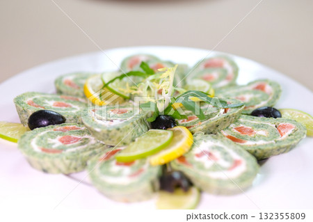 Green roll of spinach and cream cheese close up. Gourmet restaurant menu. Selective focus 132355809