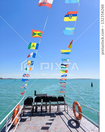 A boat ride with the flags of the world 132356266