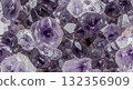 An extreme macro close-up photograph showcasing the stunning, raw, and highly detailed structure of an Amethyst geode 132356909