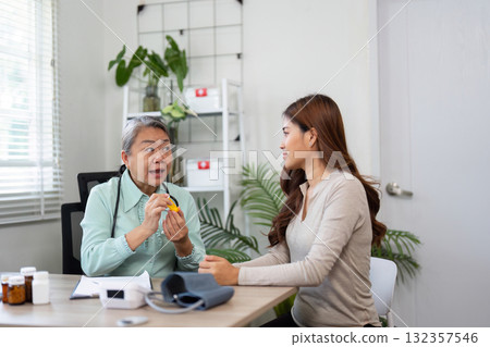 Medication Advice and Patient Education. A physician provides guidance on prescribed medications in a supportive healthcare environment. Medication Advice and Patient Education. A physician provides guidance on prescribed medications in a supportive healthcare environment. 132357546