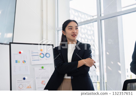 Leadership and Presenting Ideas. A professional conveys important information using visual data in a business setting. Leadership and Presenting Ideas. A professional conveys important information using visual data in a business setting. 132357651