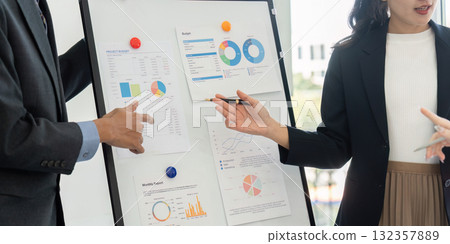 Data Presentation and Business Collaboration. Team members analyze financial reports during a key planning session. Data Presentation and Business Collaboration. Team members analyze financial reports during a key planning session. 132357889