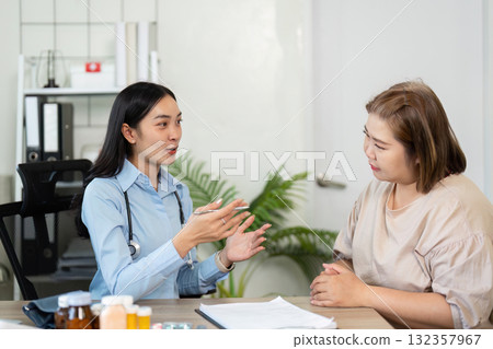 Healthcare and Patient Engagement. A healthcare professional explains treatment options while fostering a supportive environment. 132357967