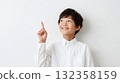 Boy pointing up index finger 132358159
