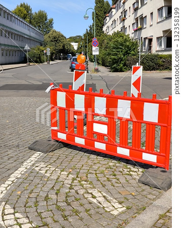 Protective road barrier with signal lights on a city street Protective road barrier with signal lights on a city street 132358199