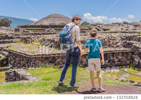 Father and his son as tourists in front of the pyramids of Teotihuacan, Mexico, enjoying sightseeing, travel, and cultural heritage together Father and his son as tourists in front of the pyramids of Teotihuacan, Mexico, enjoying sightseeing, travel, and cultural heritage together 132358828