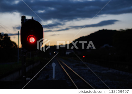 Traffic lights and rails shining in the afterglow of the sunset 132359407
