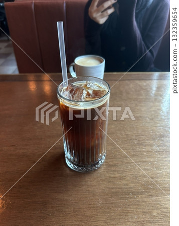 Bold and refreshing iced Americano with smooth espresso and chilled water, offering a rich aroma and deep coffee flavor. A perfect pick-me-up for a crisp and energizing drink. Bold and refreshing iced Americano with smooth espresso and chilled water, offering a rich aroma and deep coffee flavor. A perfect pick-me-up for a crisp and energizing drink. 132359654