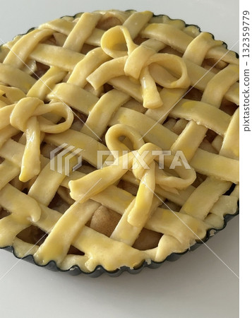 Homemade Apple Pie with fresh apples on white kitchen table, top view, flat lay. Thanksgiving traditional dessert, Thanksgiving tart preparation, autumn bakery. Crispy weather sweets. Recipe Homemade Apple Pie with fresh apples on white kitchen table, top view, flat lay. Thanksgiving traditional dessert, Thanksgiving tart preparation, autumn bakery. Crispy weather sweets. Recipe 132359779