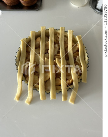 Homemade Apple Pie with fresh apples on white kitchen table, top view, flat lay. Thanksgiving traditional dessert, Thanksgiving tart preparation, autumn bakery. Crispy weather sweets. Recipe Homemade Apple Pie with fresh apples on white kitchen table, top view, flat lay. Thanksgiving traditional dessert, Thanksgiving tart preparation, autumn bakery. Crispy weather sweets. Recipe 132359780