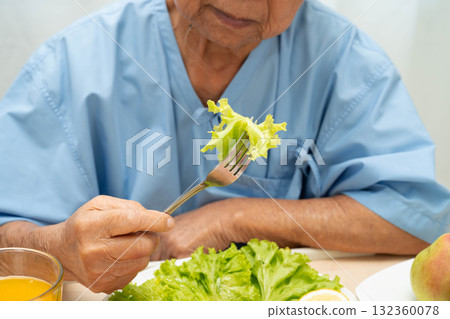 Asian elderly woman patient bored with food, anorexia loss of appetite. 132360078