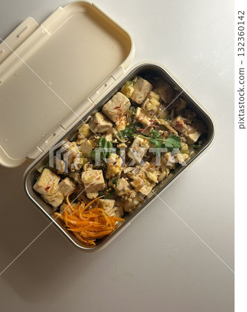 A traditional Korean dosirak, beautifully arranged with rice, assorted banchan, and savory proteins. Balanced and visually inviting, its a portable meal packed with vibrant flavors. 132360142