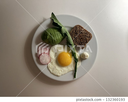A delightful brunch spread featuring a mix of savory and sweet bites. perfectly toasted bread, fresh fruits, soft scrambled eggs, and a refreshing drink to brighten your late morning. 132360193