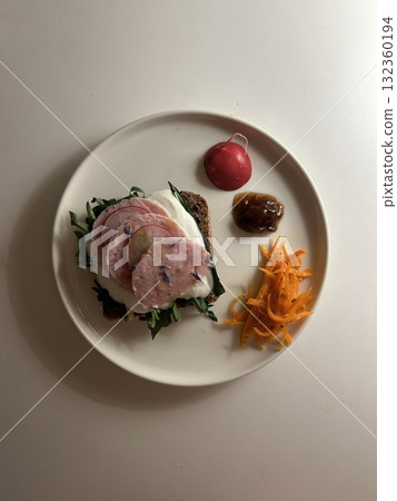 A delightful brunch spread featuring a mix of savory and sweet bites. perfectly toasted bread, fresh fruits, soft scrambled eggs, and a refreshing drink to brighten your late morning. 132360194