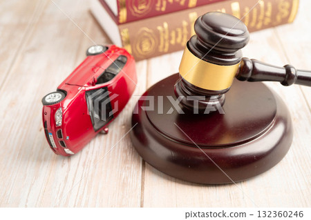 Bangkok, Thailand March 15, 2024 Car accident lawsuit and insurance, Judge hammer and money with car model. Bangkok, Thailand March 15, 2024 Car accident lawsuit and insurance, Judge hammer and money with car model. 132360246