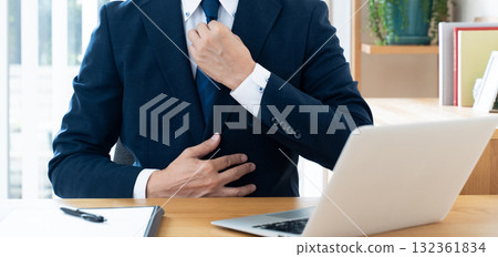 A businessman who fixes a necktie A businessman who fixes a necktie 132361834