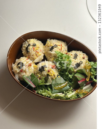 A traditional Korean dosirak, beautifully arranged with rice, assorted banchan, and savory proteins. Balanced and visually inviting, it’s a portable meal packed with vibrant flavors. A traditional Korean dosirak, beautifully arranged with rice, assorted banchan, and savory proteins. Balanced and visually inviting, it’s a portable meal packed with vibrant flavors. 132361849