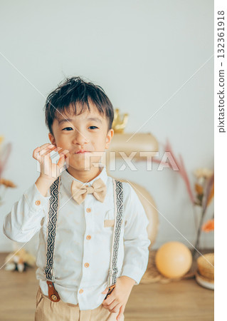 Boy being photographed at a Shichi-Go-San photo studio Boy being photographed at a Shichi-Go-San photo studio 132361918