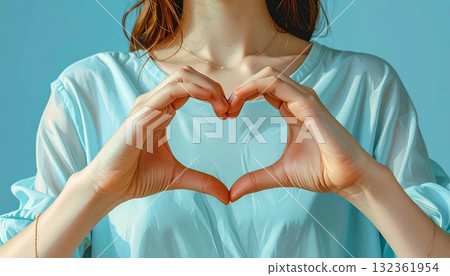 Young woman making a heart shape with her hands, light blue background, AI-generated material Young woman making a heart shape with her hands, light blue background, AI-generated material 132361954