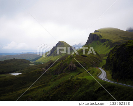 Picturesque Hills and Winding Road in a Lush Landscape With Overcast Skies Picturesque Hills and Winding Road in a Lush Landscape With Overcast Skies 132362328