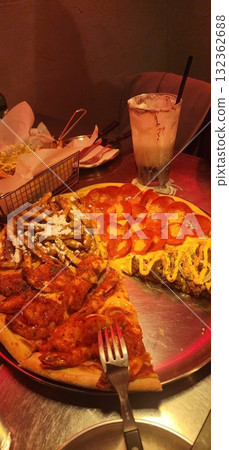 A delicious pizza with a golden crust, melted cheese, and savory toppings. Perfect for food-related designs, menus, or Italian-themed projects, capturing the essence of a classic comfort dish. 132362688