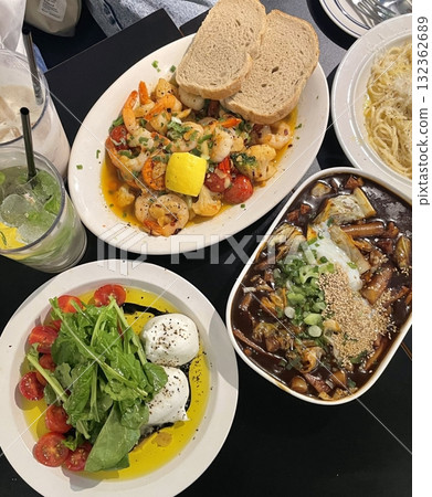 Creamy spaghetti carbonara made with rich egg yolk sauce, crispy bacon, parmesan cheese, and freshly ground black pepper for a classic, indulgent Italian pasta dish. 132362689