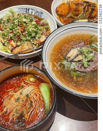 Authentic Pyongyang naengmyeon with chewy buckwheat noodles in cold, clear broth, offering a refreshing and delicate flavor. Perfect for traditional Korean cuisine menus and summer dishes. 132362736