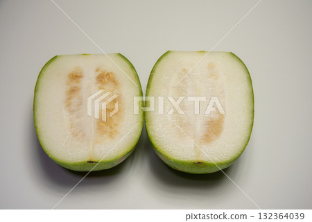 Cut winter melon placed on a white background Cut winter melon placed on a white background 132364039