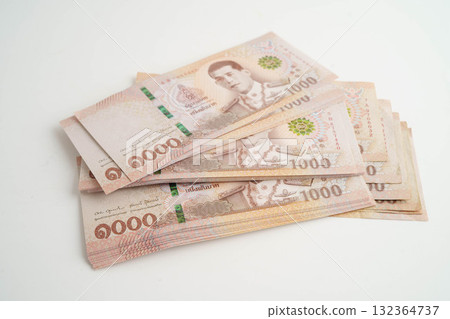Asian woman counting Thai baht banknote money and holding in hand isolated on white background. Asian woman counting Thai baht banknote money and holding in hand isolated on white background. 132364737