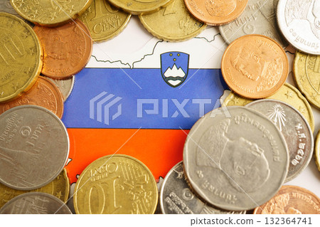 Slovenia flag on coins background, finance and accounting, banking concept. Slovenia flag on coins background, finance and accounting, banking concept. 132364741