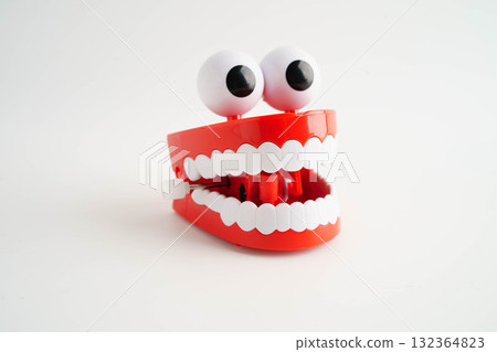 Funny red teeth with eye toy denture model for dental health care. Funny red teeth with eye toy denture model for dental health care. 132364823