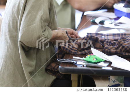 Woman making a hat Woman making a hat 132365588