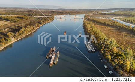 Drone Landscape of Danube River with Cargo Vessels Drone Landscape of Danube River with Cargo Vessels 132367216