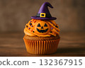 Halloween cupcakes decorated with witch hats and jack-o'-lanterns 132367915