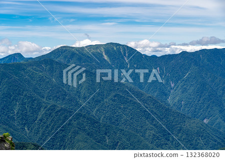 View of Mt. Hikari and Mt. Izaruga from the hiking trail of Mt. Usagi. Climbing Mt. Hijiri and Mt. Usagi in the Southern Alps. 132368020
