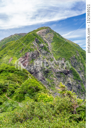 View of Mt. Hijiri and the large collapse of Mt. Hijiri from the hiking trail of Mt. Usagi. Hijiri and Usagi climbing in the Southern Alps. View of Mt. Hijiri and the large collapse of Mt. Hijiri from the hiking trail of Mt. Usagi. Hijiri and Usagi climbing in the Southern Alps. 132368021