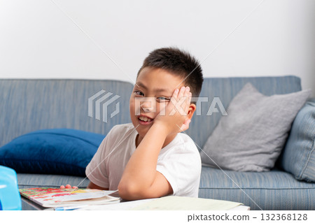 Elementary school boy learning Elementary school boy learning 132368128