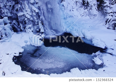 Bansho Falls in Nagano Prefecture freezes over during the harsh winter, creating a bleak expanse. 132368324
