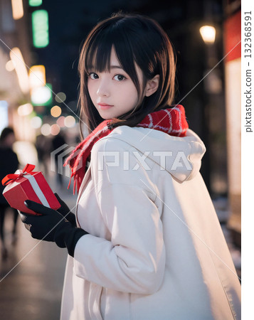 Smiling young woman holding a gift on a snowy night with sparkling Christmas lights Smiling young woman holding a gift on a snowy night with sparkling Christmas lights 132368591